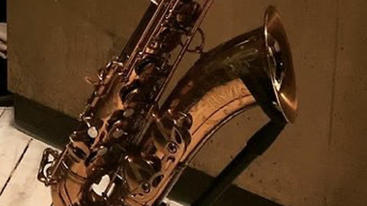 Saxophone on a stand in a room
